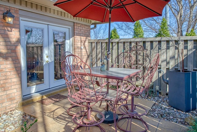 view of patio with french doors and outdoor dining space