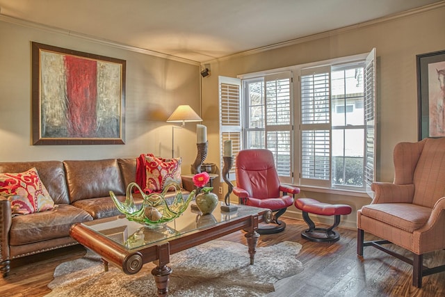 living room with a healthy amount of sunlight, wood finished floors, and ornamental molding