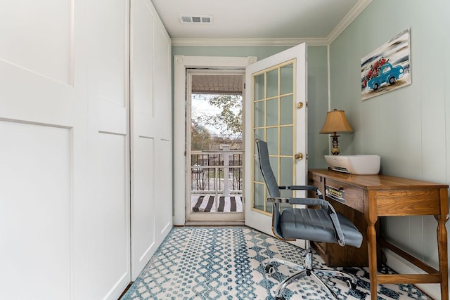 home office with visible vents, carpet floors, and ornamental molding