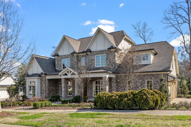 craftsman house with brick siding and roof with shingles