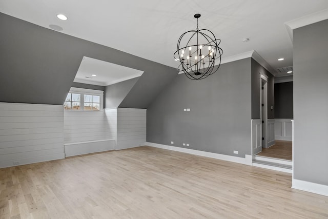 bonus room featuring recessed lighting, a chandelier, a wainscoted wall, and wood finished floors