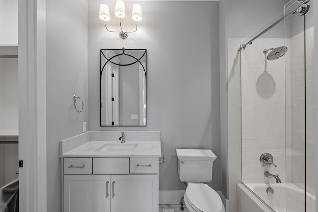 full bath featuring vanity, shower / tub combination, toilet, and baseboards