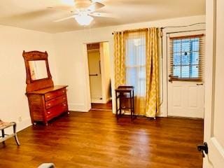 interior space with ceiling fan and wood finished floors