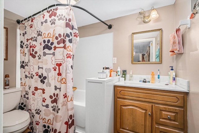 bathroom with vanity, toilet, and shower / bath combo with shower curtain