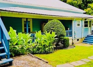 exterior space featuring a front yard and a porch