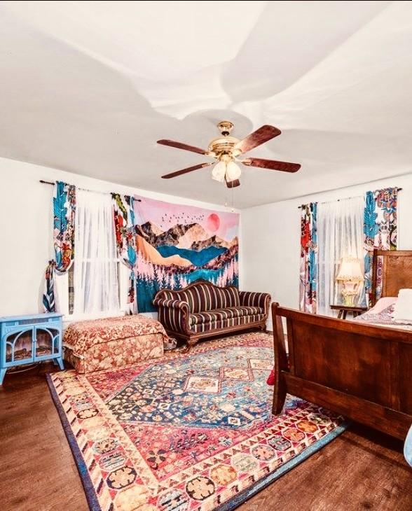 bedroom featuring ceiling fan and wood finished floors