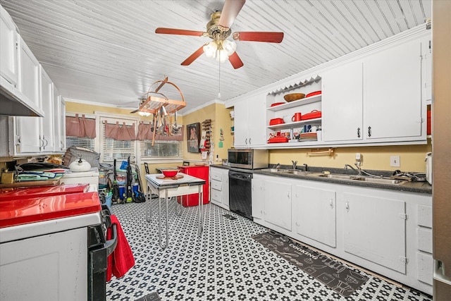 kitchen featuring dark countertops, a ceiling fan, white cabinets, dishwasher, and stainless steel microwave