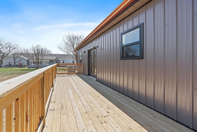 wooden terrace featuring a residential view