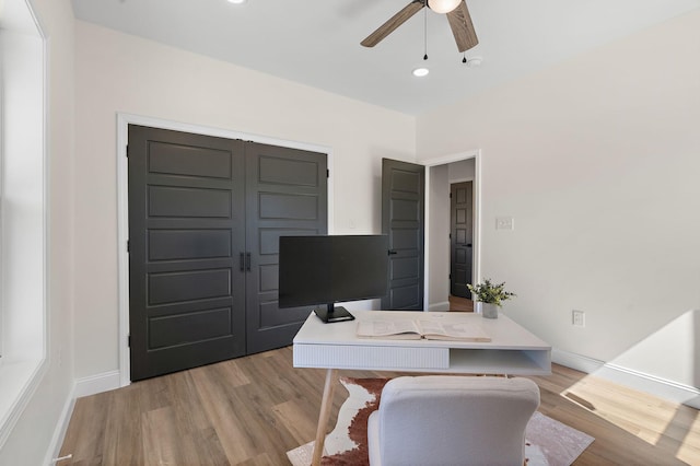 office with recessed lighting, a ceiling fan, light wood-type flooring, and baseboards