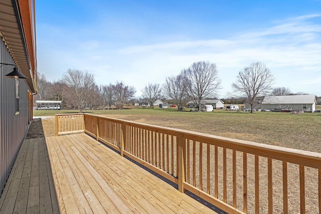 deck with a yard and a residential view