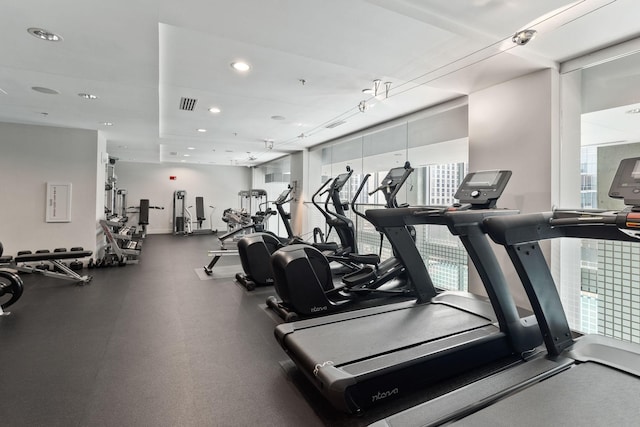 exercise room featuring recessed lighting and visible vents