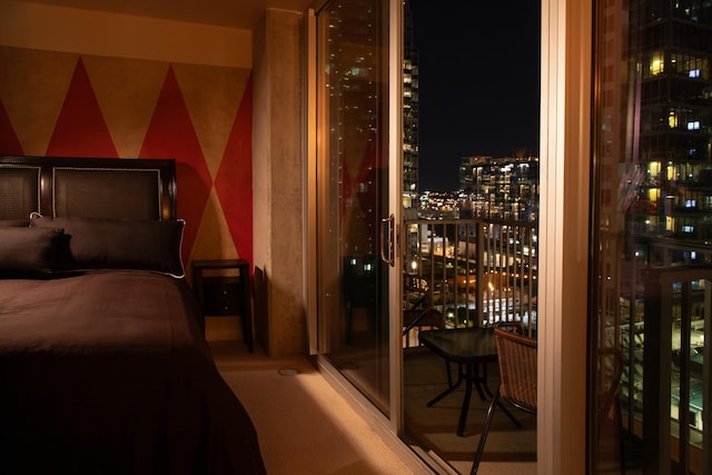 bedroom featuring a view of city lights