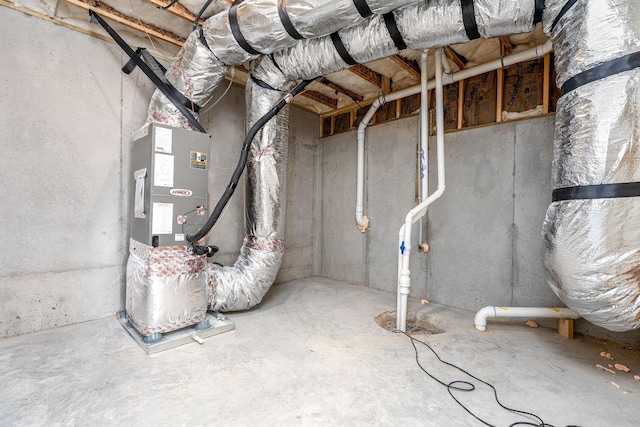 unfinished below grade area featuring heating unit