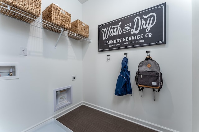 washroom with wood finish floors, washer hookup, baseboards, hookup for an electric dryer, and laundry area