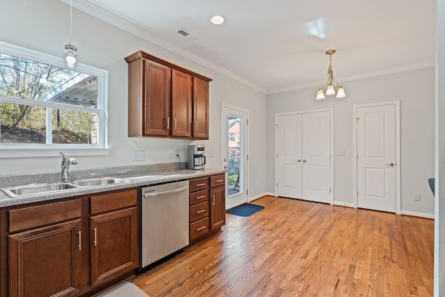 kitchen featuring dishwasher, crown molding, light wood-style floors, and a sink