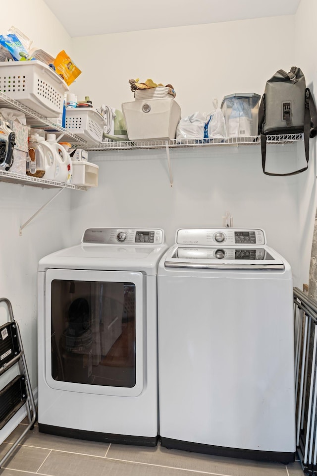 laundry room featuring washer and clothes dryer and laundry area