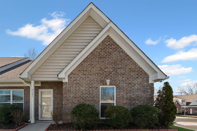 view of front of house featuring brick siding