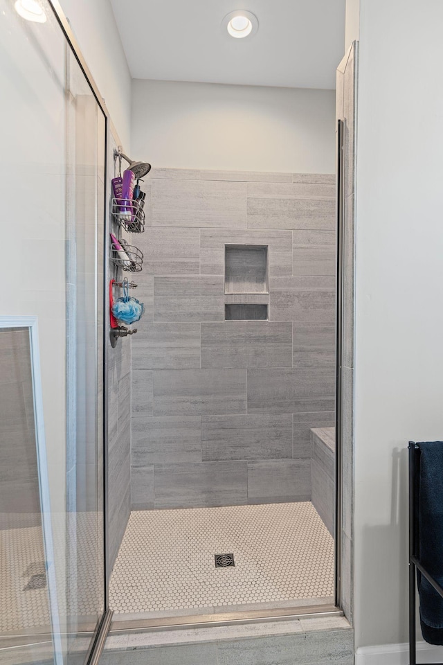 full bath with a shower stall