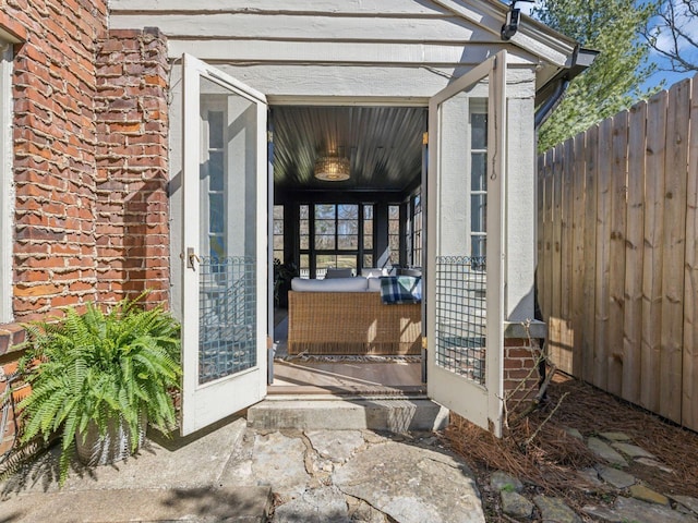 doorway to property with fence