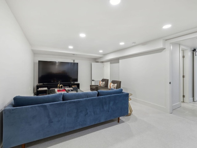 living area with recessed lighting, baseboards, and carpet floors