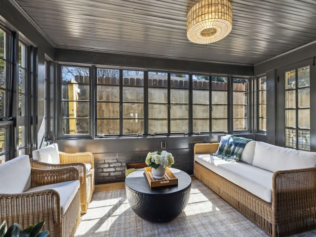 sunroom featuring wooden ceiling