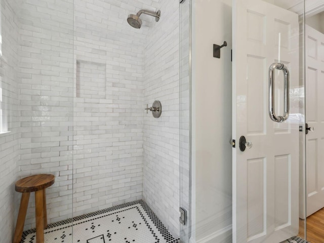 full bathroom with a shower stall