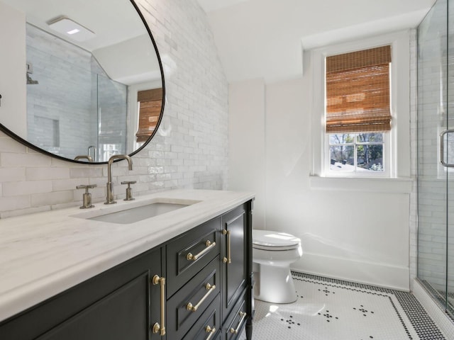 bathroom featuring vanity, decorative backsplash, a shower stall, tile patterned floors, and toilet