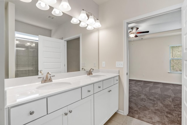 bathroom with a sink, visible vents, ceiling fan, and double vanity