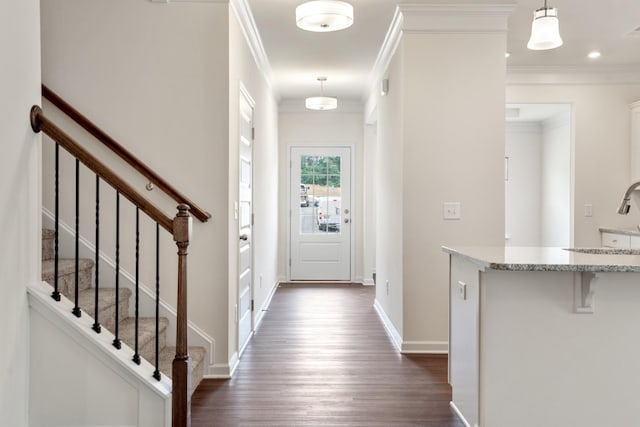 interior space with visible vents, ornamental molding, dark wood finished floors, stairway, and baseboards