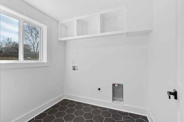 laundry room featuring baseboards, hookup for an electric dryer, washer hookup, and laundry area