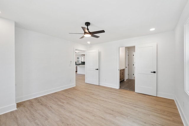 unfurnished bedroom featuring connected bathroom, baseboards, ceiling fan, recessed lighting, and light wood-style floors