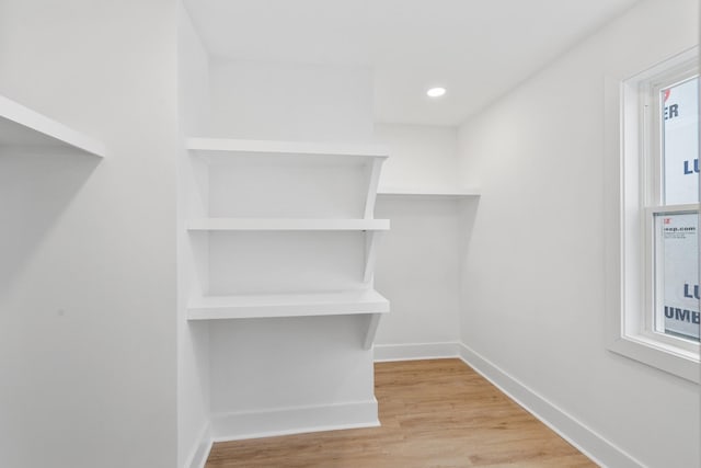 spacious closet with light wood finished floors