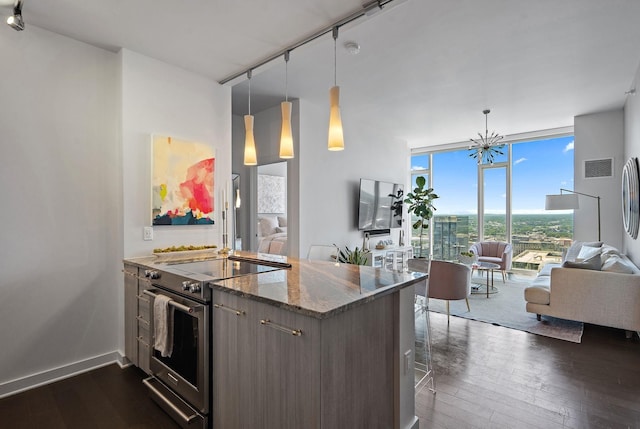 515 Church St Unit 3408, Nashville, TN 37219 - kitchen featuring a wall of windows, visible vents, dark wood finished floors, stainless steel stove, and open floor plan