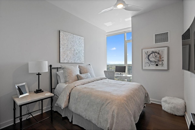 515 Church St Unit 3408, Nashville, TN 37219 - bedroom with ceiling fan, visible vents, baseboards, and dark wood-style floors