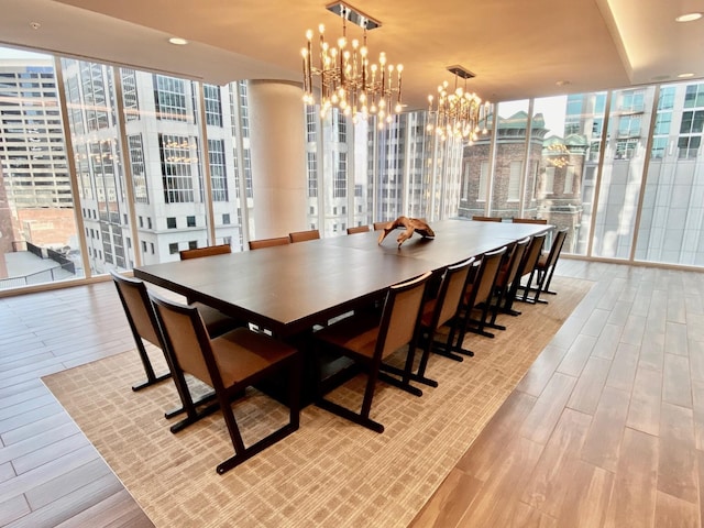 515 Church St Unit 3408, Nashville, TN 37219 - dining room featuring a chandelier, light wood-type flooring, and expansive windows