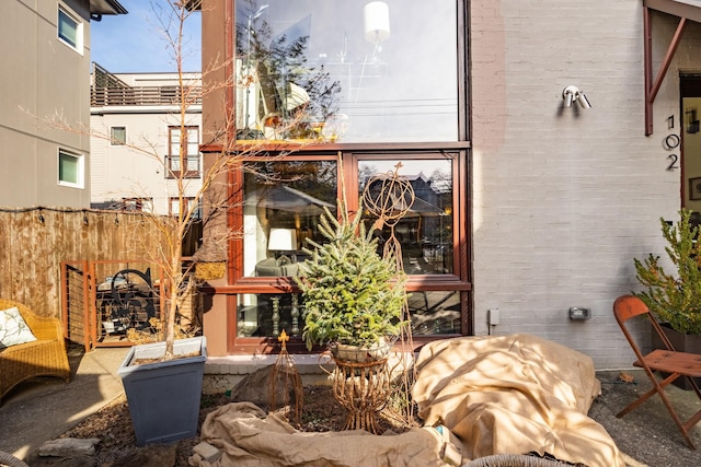 view of patio featuring fence