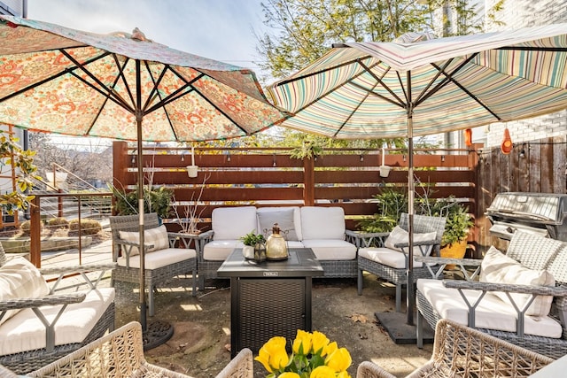 view of patio / terrace with an outdoor living space, area for grilling, and fence