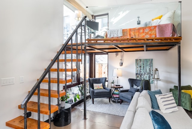 stairs featuring concrete floors