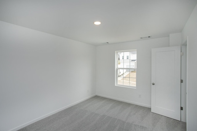 unfurnished room with recessed lighting, baseboards, visible vents, and carpet floors