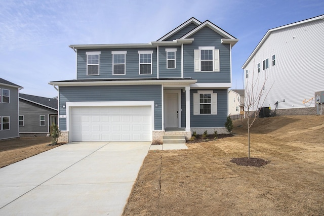 view of front of house with central AC unit, concrete driveway, and an attached garage