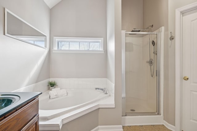 full bathroom featuring a bath, tile patterned flooring, a stall shower, and vanity