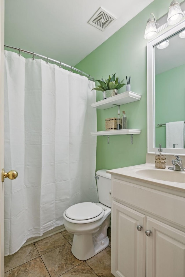 full bathroom with visible vents, toilet, and vanity