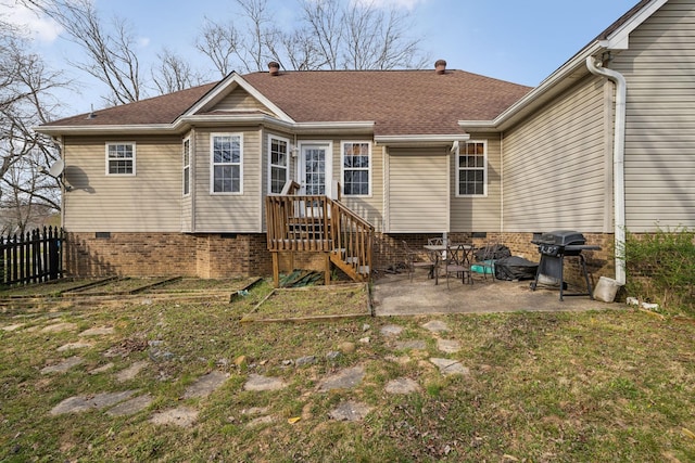 back of property featuring a patio, a shingled roof, and fence