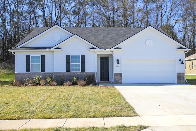 single story home with roof with shingles, an attached garage, concrete driveway, a front lawn, and brick siding