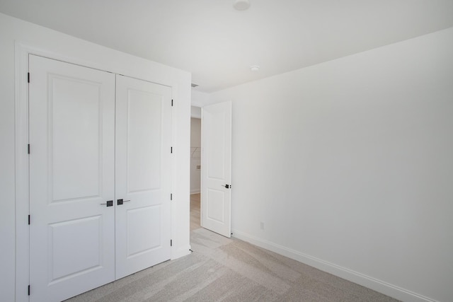 2359 Williamsport Lndg, Columbia, TN 38401 - unfurnished bedroom with a closet, baseboards, and light colored carpet