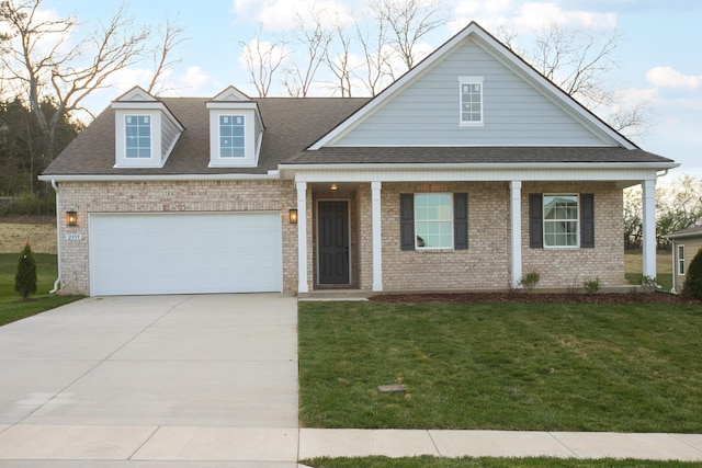 2359 Williamsport Lndg, Columbia, TN 38401 - view of front facade featuring driveway, an attached garage, a front lawn, and roof with shingles