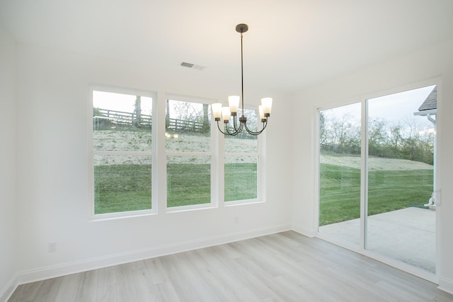 2359 Williamsport Lndg, Columbia, TN 38401 - unfurnished dining area featuring baseboards, visible vents, an inviting chandelier, and light wood finished floors