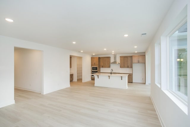 2359 Williamsport Lndg, Columbia, TN 38401 - unfurnished living room with a sink, recessed lighting, light wood finished floors, and visible vents