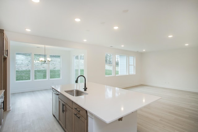 2359 Williamsport Lndg, Columbia, TN 38401 - kitchen with dishwasher, recessed lighting, a sink, light wood-type flooring, and a notable chandelier