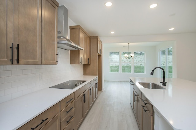 2359 Williamsport Lndg, Columbia, TN 38401 - kitchen featuring light countertops, a sink, wall chimney exhaust hood, black electric cooktop, and decorative backsplash